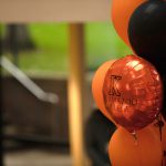 Matte Orange, Metallic Orange, and Black ballons